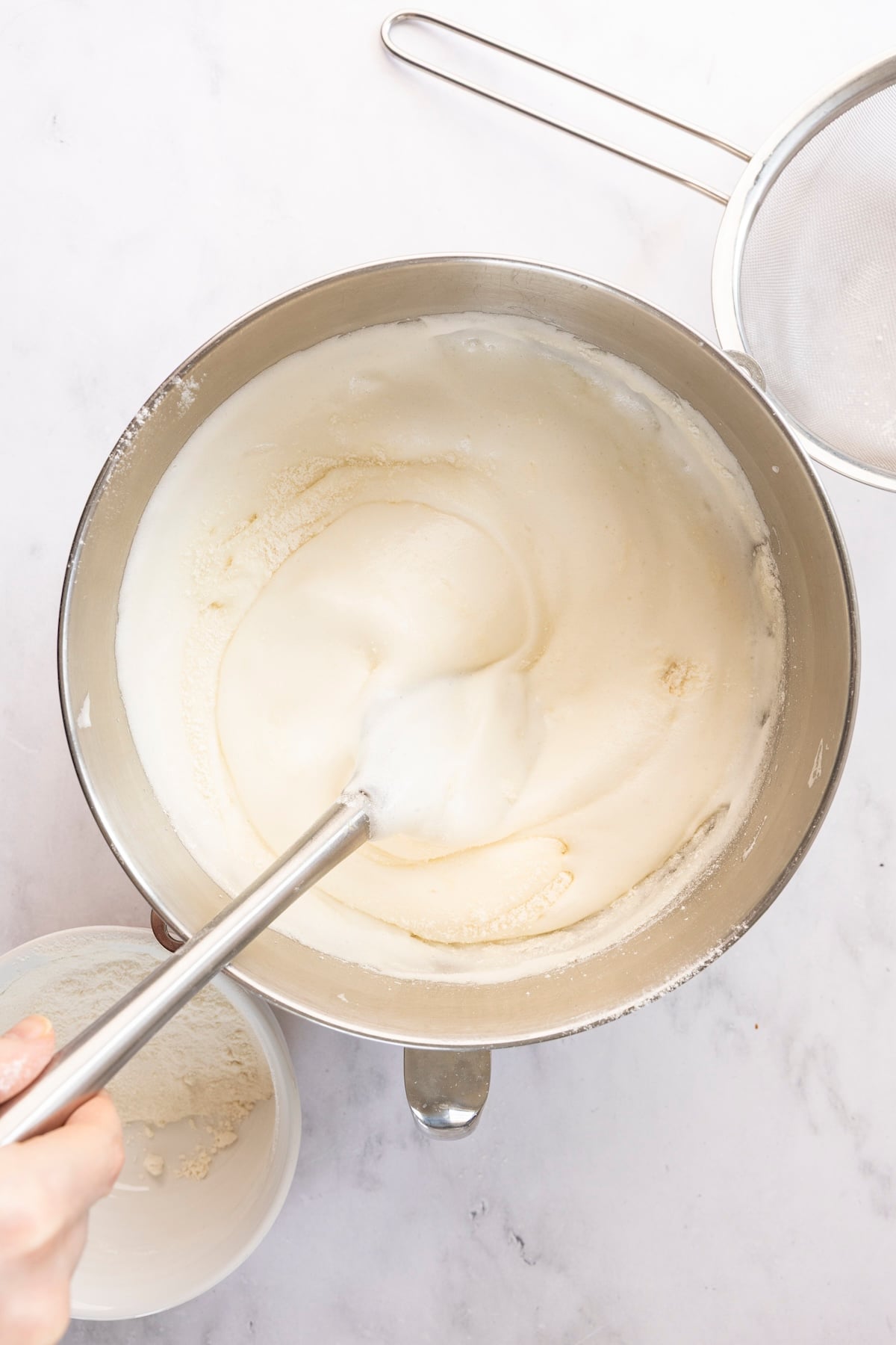 angel food cake batter fully combined in mixing bowl