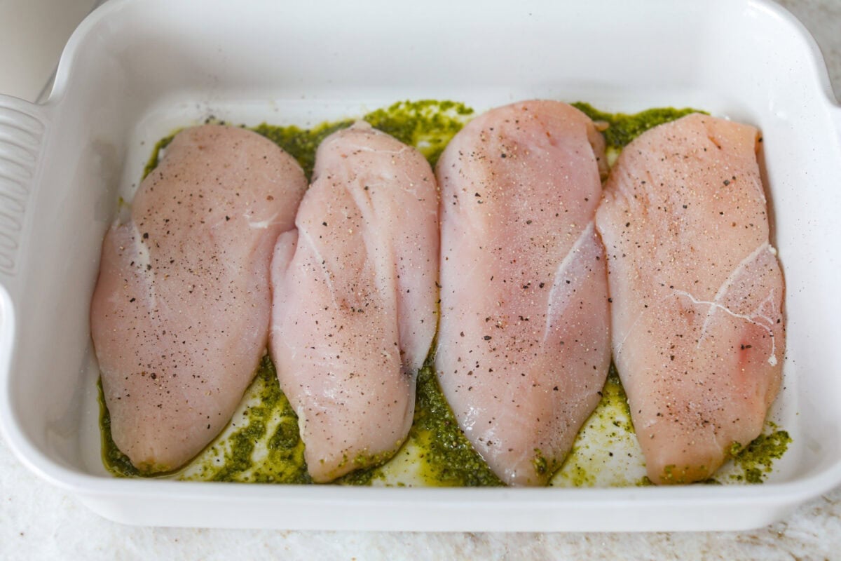 Chicken breasts added to the top of the pesto. 