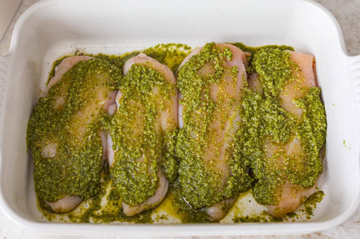 Pesto smothered across the top of the chicken breasts. 