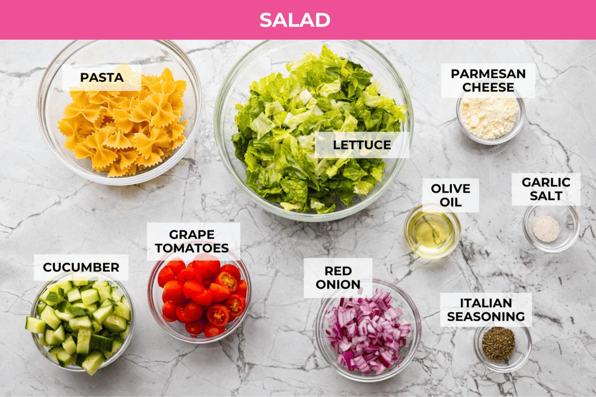 Overhead shot of labeled crispy pasta salad ingredients. 