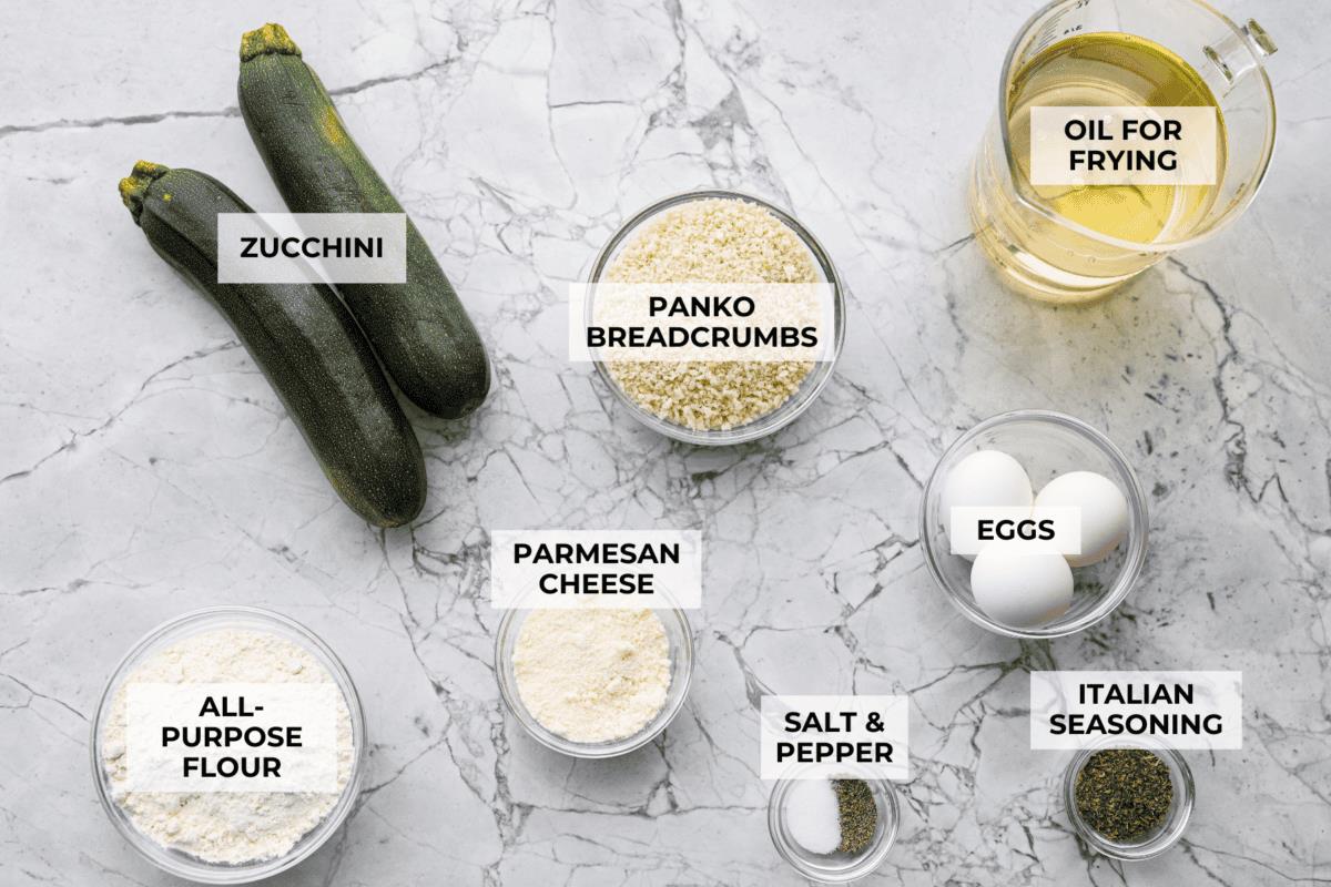 Overhead shot of labeled fried zucchini ingredients. 