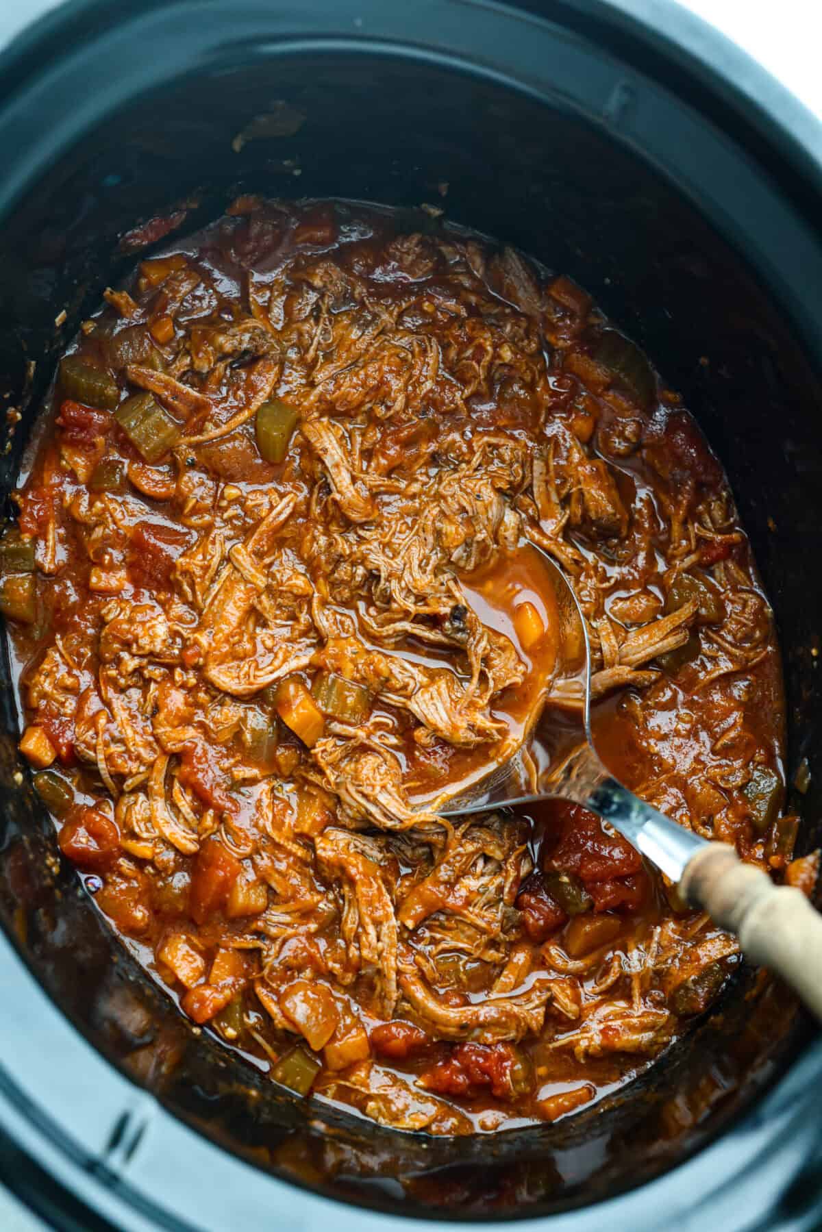 Slow cooker with Beef Ragu ready to be eaten. 