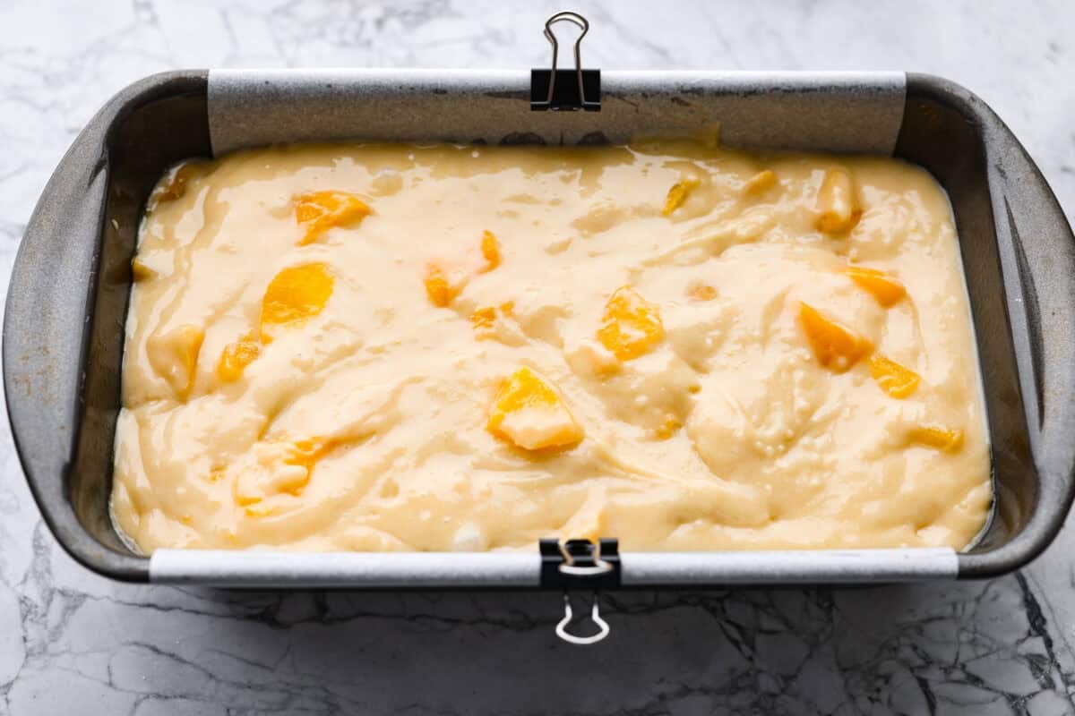 Peach loaf batter in a baking pan. 