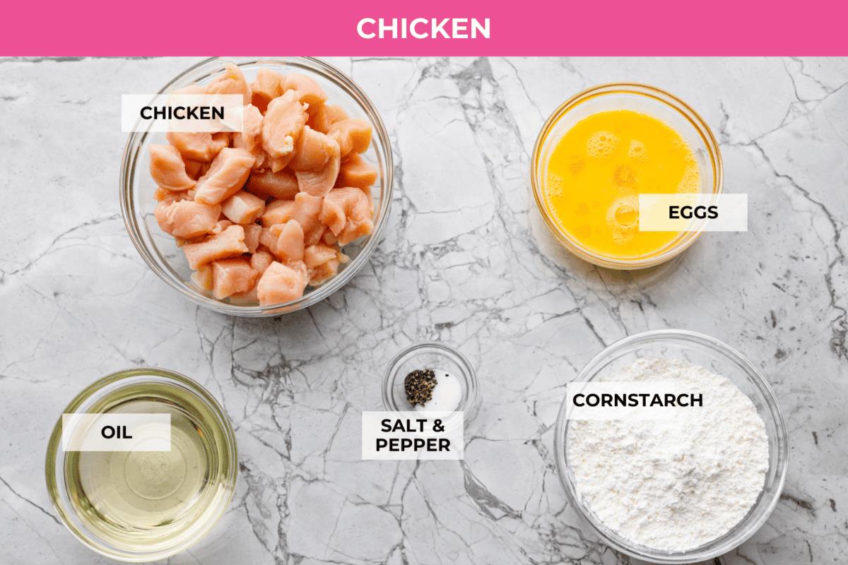 Overhead shot of labeled Chinese lemon chicken ingredients. 