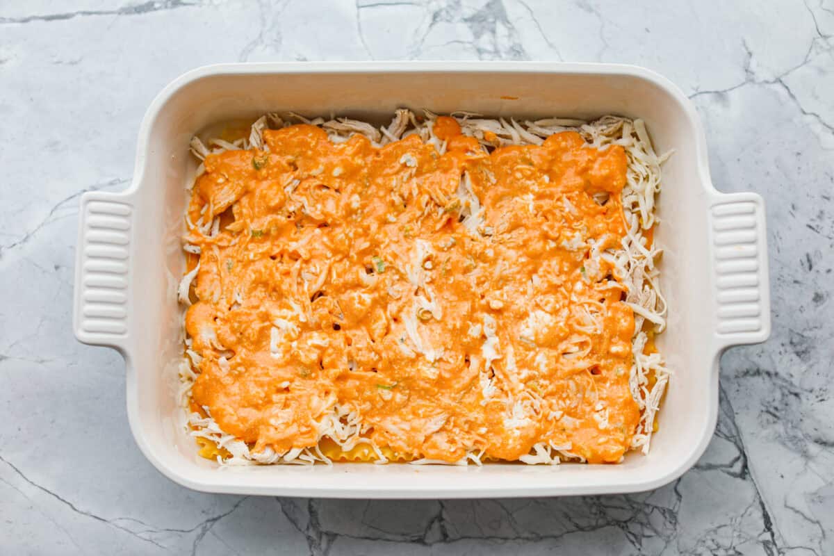 Sauce spread out over the chicken.