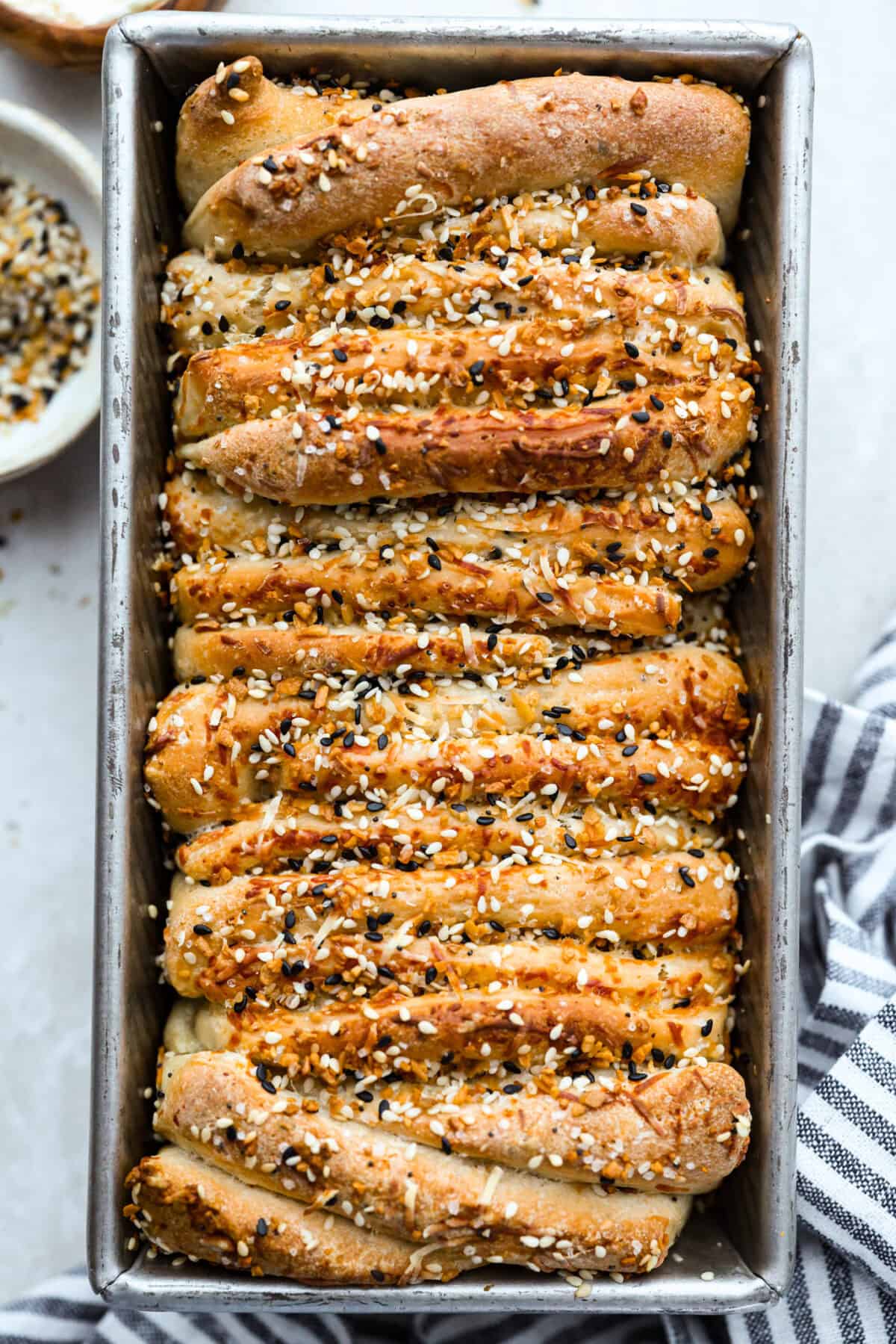 Everything bagel seasoning pull apart bread all baked and golden brown. 