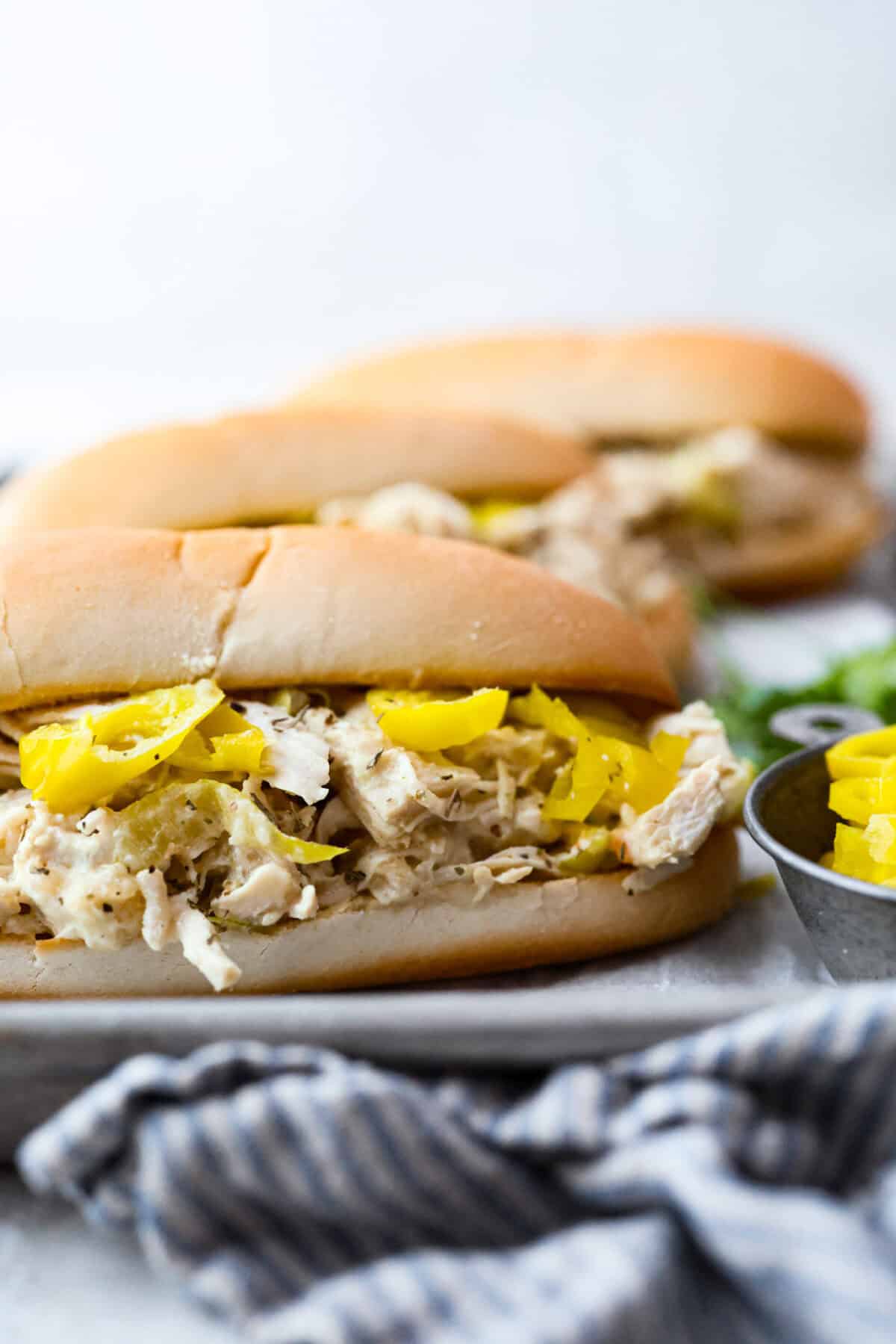 Crockpot Italian grinder chicken added to a hoagie bun. 