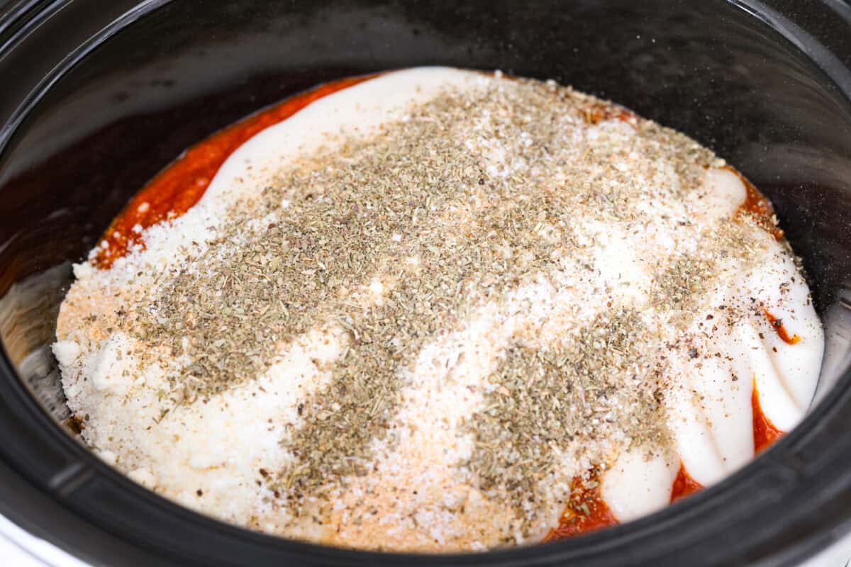 Sauces and seasonings added to the chicken in the crockpot. 
