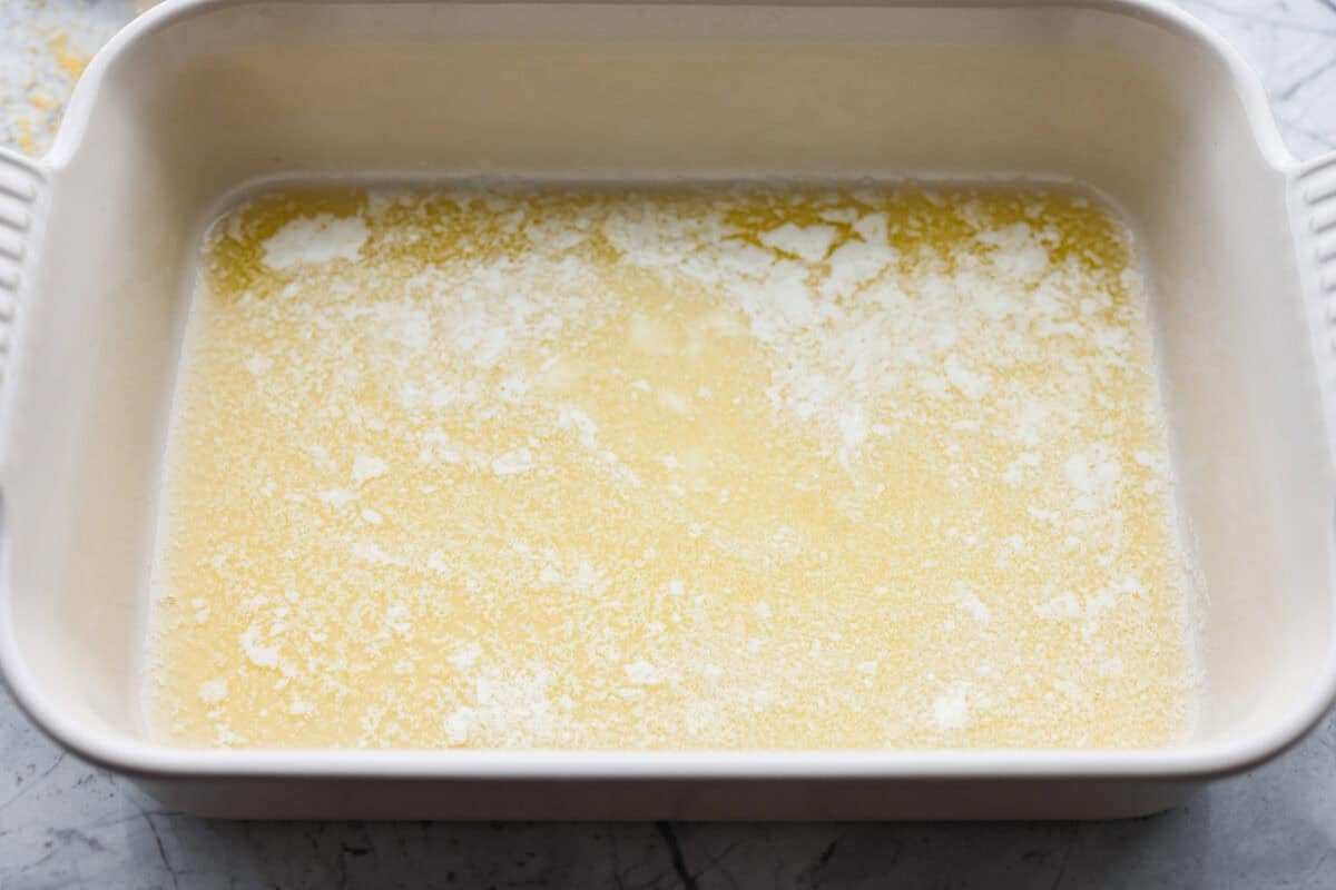 Melted butter in the bottom of the baking dish. 