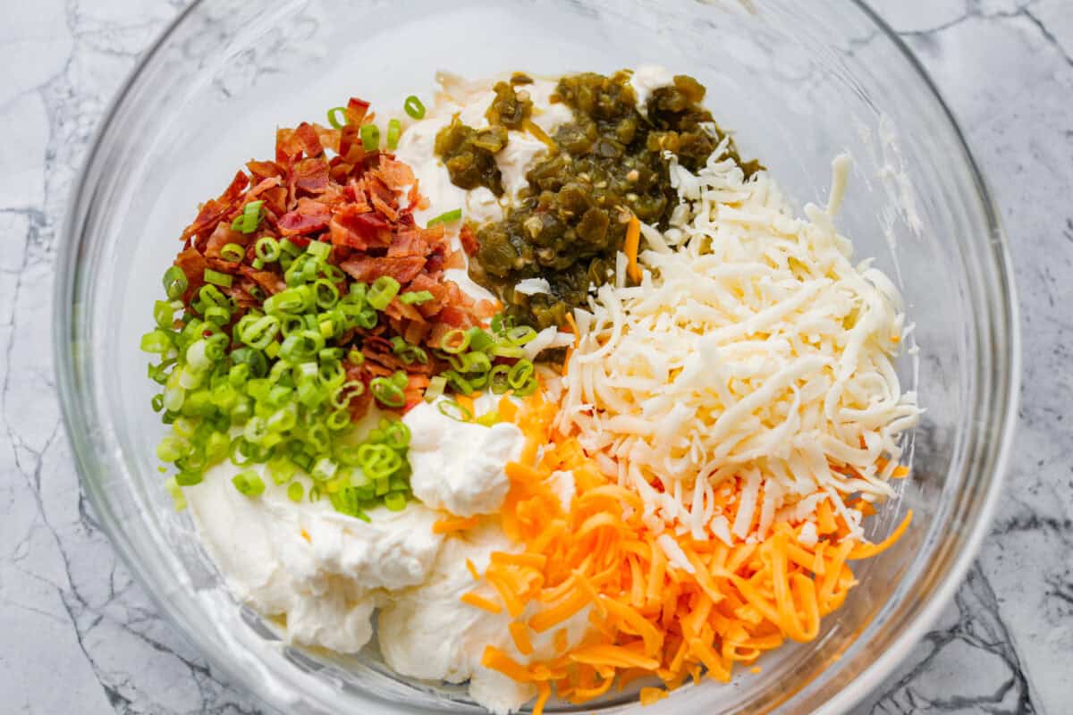 Dip ingredients added to a bowl. 