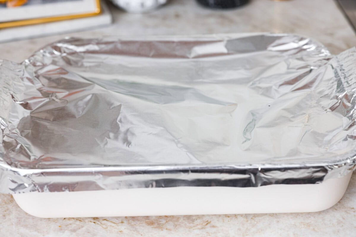 Broth, rice and veggie mixture all covered with foil, ready to go into the oven. 